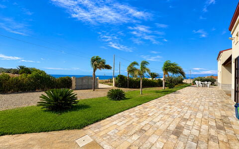 Villa Marzia: Blue, Sea, Ocean, Landscaping, Flagstone, Walkway, Coast, Shade, Tropics