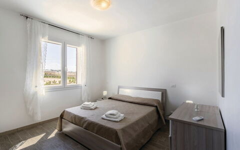Villa Marzia: Apartment, Hardwood, Bedroom, Bed, Bedding, Wood Flooring, Bed Frame, Plank