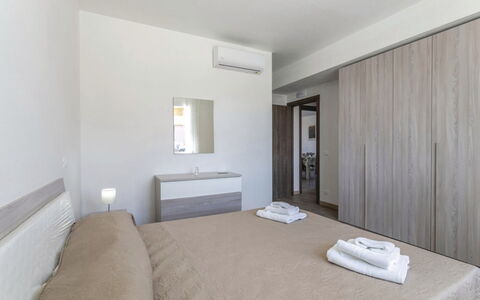 Villa Marzia: Interior Design, Flooring, Floor, Furniture, Wood, Bedroom, Bed, Ceiling, Room, Apartment