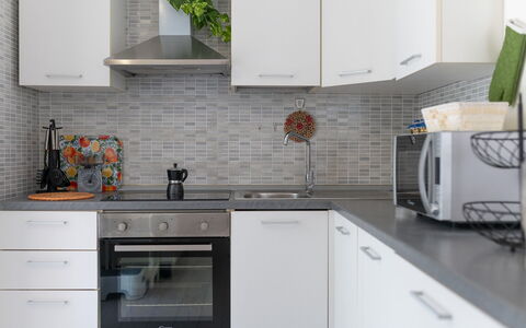 Villa Margherita: Kitchen, Countertop, Kitchen Appliance, Cabinetry, Interior Design, Major Appliance, Flooring, Home, Furniture, Sink