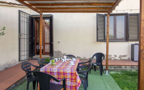 Gli Ulivi: Wood, Floor, Flooring, Furniture, Door, Wood Stain, Shade, Porch, Backyard, Outdoor Structure