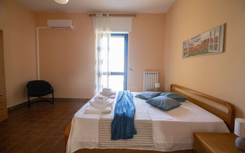 Elena'S House in Otranto: Furniture, Interior Design, Bed, Bedroom, Floor, Flooring, Wood, Bed Sheet, Room, Bedding