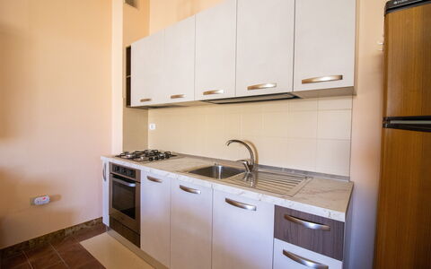 Elena'S House in Otranto: Major Appliance, Flooring, Interior Design, Kitchen Appliance, Wood, Kitchen, Floor, Countertop, Cabinetry, Kitchen Sink