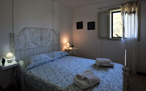 Villa Andrea: Bed, Bedroom, Bedding, Bed Sheet, Furniture, Linens, Bed Frame, Floor, Interior Design, Room
