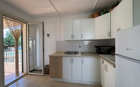 Villa Andrea: Wood, Flooring, Kitchen, Floor, Countertop, Interior Design, Major Appliance, Furniture, Kitchen Appliance, Cabinetry