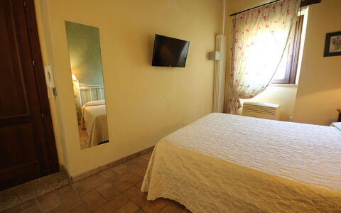 Residence Borgodamare: Bed, Bedroom, Floor, Flooring, Wood, Bed Sheet, Interior Design, Bedding, Ceiling, Furniture