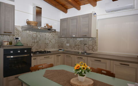 Villa Mameli: Kitchen, Countertop, Interior Design, Kitchen Appliance, Wood, Furniture, Major Appliance, Flooring, Cabinetry, Kitchen Sink