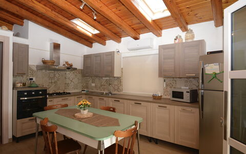 Villa Mameli: Furniture, Kitchen, Interior Design, Flooring, Countertop, Wood, Cabinetry, Kitchen Appliance, Ceiling, Chair