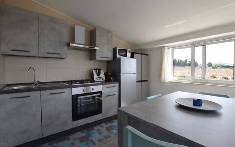 Villa Giugiola: Countertop, Kitchen, Furniture, Flooring, Floor, Interior Design, Plumbing Fixture, Ceiling, Major Appliance, Sink