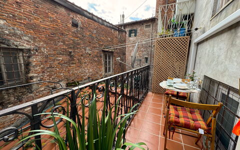 Alla Torre: Flowerpot, Brick, Iron, Balcony, Metal, Apartment, Houseplant, Brickwork, Handrail, Chair
