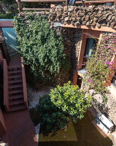 Villa Boi: Wall, Architecture, Stone Wall, Garden, Shade, Landscaping, Hacienda, Backyard
