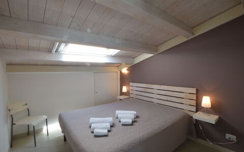 Appartamento Tramonto sul Mare: Bed, Bedroom, Interior Design, Furniture, Wood, Floor, Ceiling, Bed Sheet, Flooring, Bedding
