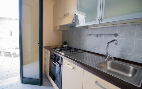 Nicoletta'S House in Otranto: Kitchen, Countertop, Kitchen Sink, Kitchen Appliance, Major Appliance, Flooring, Interior Design, Kitchen Stove, Plumbing Fixture, Tap