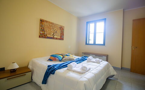 Nicoletta'S House in Otranto: Wood, Bedroom, Floor, Bed, Flooring, Bed Sheet, Interior Design, Bed Frame, Bedding, Room