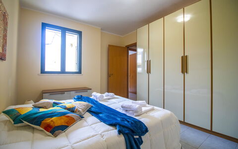 Nicoletta'S House in Otranto: Wood, Interior Design, Flooring, Floor, Bedroom, Bed, Room, Furniture, Ceiling, Apartment