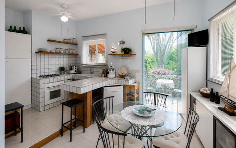 Villa Lina: Furniture, Interior Design, Kitchen, Chair, Flooring, Countertop, Table, Light Fixture, Kitchen & Dining Room Table, Ceiling