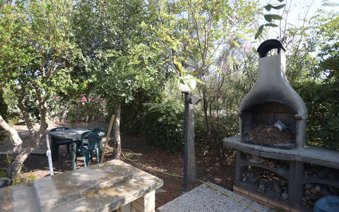 Villa Lina: Garden, Woody Plant, Shade, Backyard, Landscaping, Yard, Outdoor Furniture, Flowerpot, Outdoor Table, Outdoor Structure