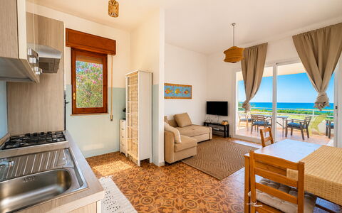 Punta Braccetto Fronte Mare: Furniture, Flooring, Floor, Interior Design, Sea, Chair, Wood Stain, Wood Flooring, Kitchen & Dining Room Table, Ocean