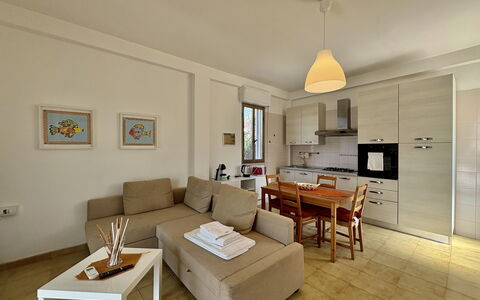 Punta Braccetto Fronte Mare: Furniture, Interior Design, Flooring, Floor, Room, Couch, Wood, Ceiling, Table, Living Room