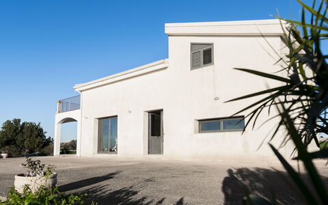 Villa Costa: Sky, Architecture, Home, Residential Area, Composite Material, Estate, Door, Concrete, Shade, Driveway