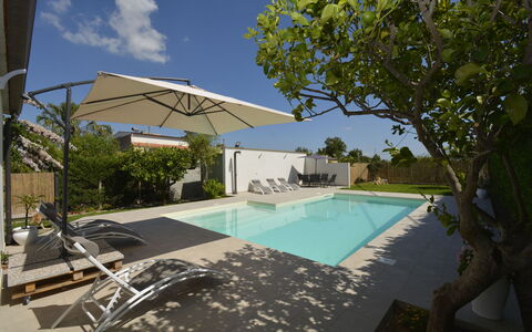 Villa Benvenuti al Sud: Swimming Pool, Resort, Outdoor Furniture, Composite Material, Shade, Eco Hotel, Sunlounger, Umbrella, Leisure, Villa