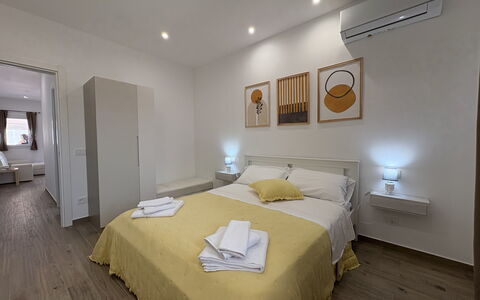 Villa Benvenuti al Sud: Floor, Wood, Flooring, Interior Design, Ceiling, Bedroom, Bed, Furniture, Room, Wood Flooring