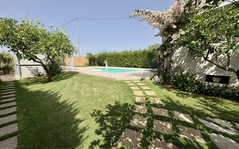Villa Benvenuti al Sud: Garden, Swimming Pool, Lawn, Shade, Landscaping, Backyard, Yard, Flagstone, Artificial Turf