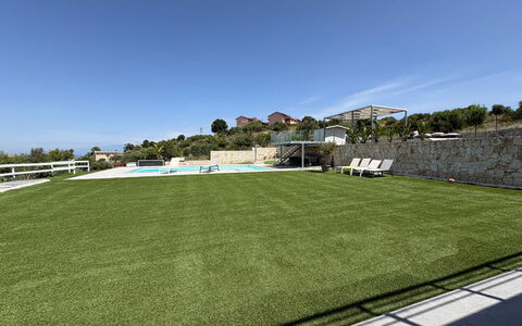Rari House: Artificial Turf, Lawn, Shade, Landscaping, Fence, Park, Net, Swimming Pool