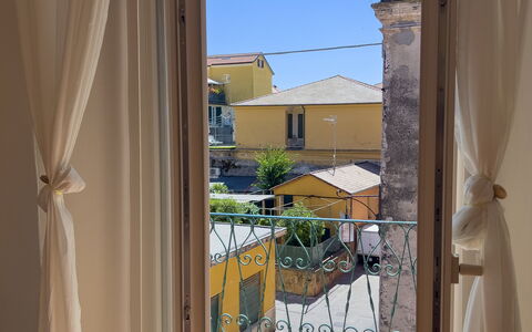 Casa Nanai - Levanto: Interior Design, Floor, Door, Curtain, Window Treatment, Balcony, Glass, Window Covering, Home Door, Wood Stain