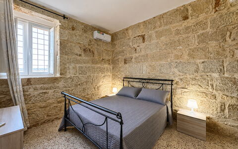 L'Oasi di Salvo: Flooring, Floor, Ceiling, Stone Wall, Bedroom, Bed Frame, Bed, Bedding
