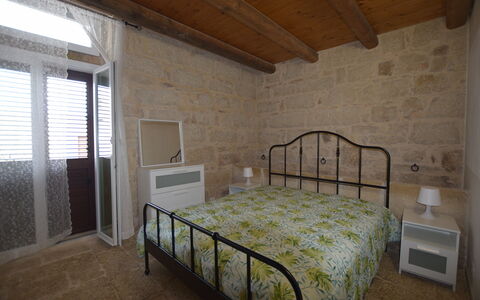 L'Oasi di Salvo: Furniture, Interior Design, Flooring, Bedroom, Floor, Bed, Ceiling, Room, Lighting, Bedding