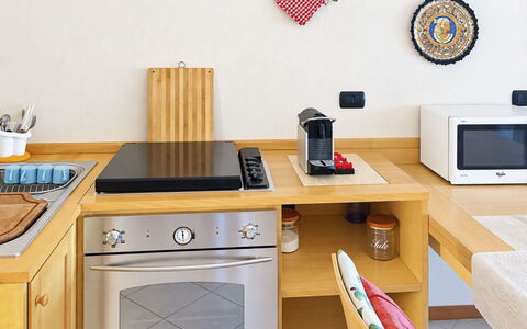Coniglio Beach: Kitchen, Kitchen Appliance, Major Appliance, Wood, Furniture, Home Appliance, Kitchen Stove, Countertop, Small Appliance, Stove