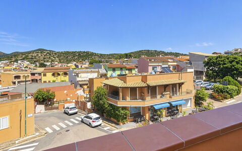 Coniglio Beach: Building, Window, Residential Area, Town, Facade, Urban Area, Neighbourhood, Architecture, Home, House