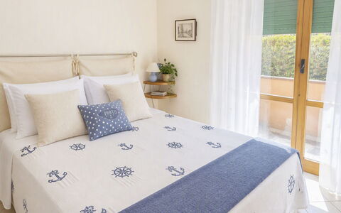 Coniglio Beach: Bedroom, Bed, Furniture, Bed Sheet, Linens, Wood, Bedding, Interior Design, Textile, Floor