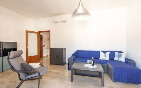 Casa Acquamarina: Furniture, Interior Design, Flooring, Floor, Couch, Wood, Room, Living Room, Table, Apartment