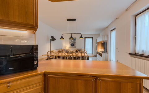 Sun: Kitchen, Interior Design, Countertop, Cabinetry, Furniture, Wood, Ceiling, Light Fixture, Flooring, Kitchen Appliance