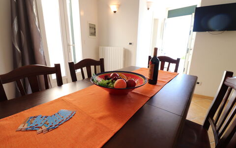 Casa Rachele a Otranto: Furniture, Table, Tableware, Wood, Interior Design, Dining Room, Tablecloth, Kitchen & Dining Room Table, Chair, Flooring