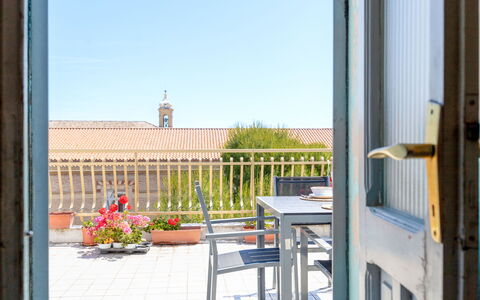 Attico del Corso: Apartment, Flowerpot, Chair, Houseplant, Wood Stain, Outdoor Furniture, Kitchen & Dining Room Table, Balcony