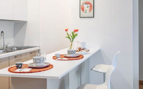 Suite Pineta: Furniture, Interior Design, Kitchen, Wood, Flooring, Countertop, Table, Kitchen Appliance, Floor, Room
