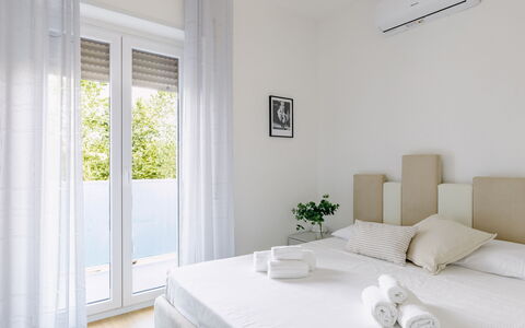Suite Pineta: Furniture, Interior Design, Wall, Bed, Floor, Wood, Flooring, Bedroom, Room, Home