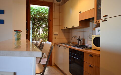 Il Favollo: Kitchen, Countertop, Kitchen Appliance, Interior Design, Major Appliance, Flooring, Cabinetry, Wood, Furniture, Floor
