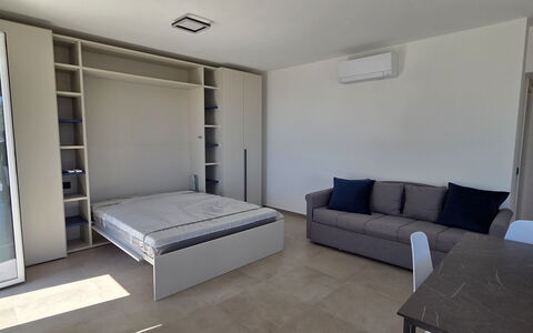 Villa Pineta della Rovere: Furniture, Flooring, Floor, Interior Design, Wood, Room, Apartment, Lighting, Bedroom, Bed