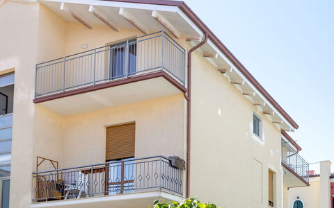 Seaside Apartment: Balcony, Residential Area, Home, Handrail, Composite Material, Baluster, Porch, Apartment, Metal, Paint