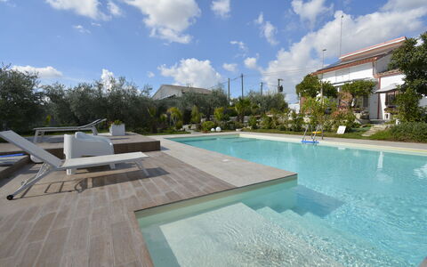 La Dimora di Artemide: Swimming Pool, Resort, Composite Material, Garden, Landscaping, Water Feature, Shade, Eco Hotel, Backyard, Leisure