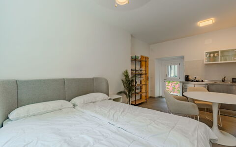 Via Monte Brione: Furniture, Interior Design, Bed, Wall, Flooring, Bedroom, Floor, Ceiling, Wood, Room