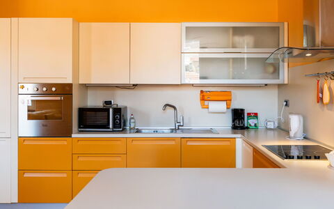 Daisy: Kitchen, Countertop, Kitchen Appliance, Cabinetry, Interior Design, Furniture, Major Appliance, Wood, Yellow, Orange