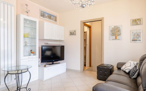 Sweet Loreto: Furniture, Interior Design, Flooring, Wood, Room, Floor, Ceiling, Television, Living Room, Lighting