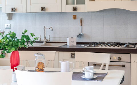 Sweet Loreto: Kitchen, Furniture, Countertop, Kitchen Appliance, Interior Design, Cabinetry, Wood, Major Appliance, Flooring, Tableware