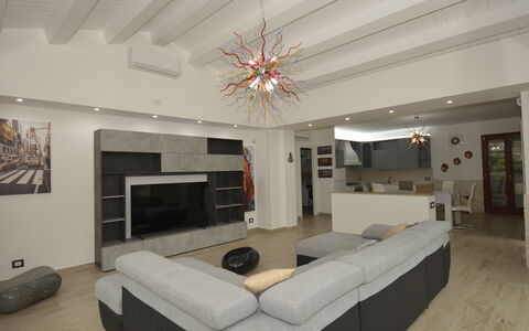 Villa Monaco: Furniture, Interior Design, Flooring, Wall, Floor, Ceiling, Wood, Couch, Living Room, Light Fixture