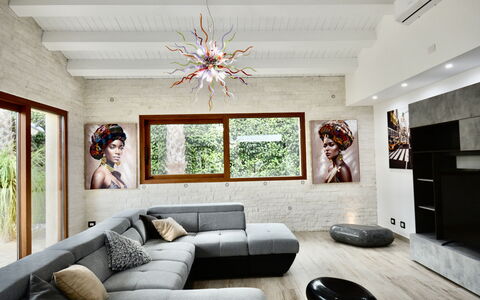 Villa Monaco: Furniture, Interior Design, Flooring, Couch, Floor, Wall, Living Room, Wood, Home, Ceiling